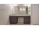 Bathroom featuring dual sinks, granite countertops, and dark wood cabinets at 22500 Provance Ave, Port Charlotte, FL 33954