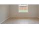 Bedroom featuring a window with view of the backyard at 22500 Provance Ave, Port Charlotte, FL 33954