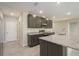 Well-lit kitchen boasts stainless steel appliances, granite countertops, and ample cabinet space at 22500 Provance Ave, Port Charlotte, FL 33954