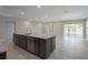 Spacious kitchen with island, stainless steel dishwasher and door to backyard at 22500 Provance Ave, Port Charlotte, FL 33954