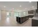 Spacious kitchen featuring a large island, stainless steel appliances, and ample counter space at 22500 Provance Ave, Port Charlotte, FL 33954