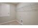 Laundry room featuring shelving, tile floor, and washer/dryer hookups at 22500 Provance Ave, Port Charlotte, FL 33954