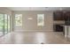 Spacious living room featuring tile floors, ample natural light and dark wood cabinets at 22500 Provance Ave, Port Charlotte, FL 33954