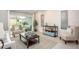 Bright living room with a sliding glass door leading to an outdoor seating area at 22500 Provance Ave, Port Charlotte, FL 33954