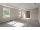 Main bedroom boasting natural light and a tray ceiling at 22500 Provance Ave, Port Charlotte, FL 33954