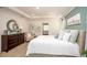Calming primary bedroom with tray ceiling, ensuite bathroom access, and ample storage at 22500 Provance Ave, Port Charlotte, FL 33954