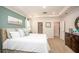 Inviting primary bedroom featuring a tray ceiling, ensuite access, and generous closet space at 22500 Provance Ave, Port Charlotte, FL 33954