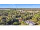 Expansive aerial view of a secluded property surrounded by lush greenery and landscaping at 6098 San Salvador Rd, North Port, FL 34291
