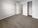 Bedroom with carpet floors, closet and door to a hallway at 9793 Rally Spring Loop, Wesley Chapel, FL 33545