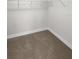 Walk-in closet featuring carpet flooring and wire shelving at 9793 Rally Spring Loop, Wesley Chapel, FL 33545