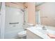 Well-lit bathroom featuring shower-tub combination, a vanity and tile flooring at 2224 Mayfield Palms Ln # 321, Sun City Center, FL 33573