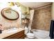 Bathroom features a vanity, toilet, combination shower and tub at 7961 50Th N Ave, St Petersburg, FL 33709