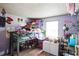 ' bedroom with gray bunk bed, natural light and purple walls at 7961 50Th N Ave, St Petersburg, FL 33709