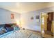 Cozy bedroom with comfortable bed, decorative pillows, and access to additional room at 7961 50Th N Ave, St Petersburg, FL 33709