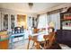 Bright dining room with wood table, chandelier, and charming built-in shelving at 7961 50Th N Ave, St Petersburg, FL 33709