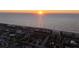 The golden sun sets over the ocean, photographed from a beachside community with homes at 2200 Bay Blvd # B, Indian Rocks Beach, FL 33785
