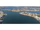 Expansive aerial view showcasing waterfront homes, boat docks, and lush landscapes along the tranquil bay at 2200 Bay Blvd # B, Indian Rocks Beach, FL 33785