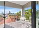 Cozy balcony with a table and chairs, overlooking a residential neighborhood at 2200 Bay Blvd # B, Indian Rocks Beach, FL 33785