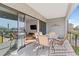 Outdoor balcony with seating and view to the interior of the home at 2200 Bay Blvd # B, Indian Rocks Beach, FL 33785