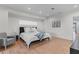 Bright bedroom featuring hardwood floors, a comfy bed, and neutral decor at 2200 Bay Blvd # B, Indian Rocks Beach, FL 33785