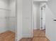 Walk in closet featuring wood floors at 2200 Bay Blvd # B, Indian Rocks Beach, FL 33785