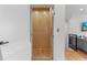 Modern home elevator with wood paneling, providing easy access between floors and enhanced accessibility at 2200 Bay Blvd # B, Indian Rocks Beach, FL 33785