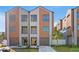 Modern townhome featuring a two-car garage, balcony, and neutral-toned facade at 2200 Bay Blvd # B, Indian Rocks Beach, FL 33785