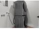 Modern laundry room with a stacked washer and dryer at 2200 Bay Blvd # B, Indian Rocks Beach, FL 33785