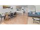 Inviting living room featuring dining area, modern kitchen with island seating and comfortable gray sofa at 2200 Bay Blvd # B, Indian Rocks Beach, FL 33785