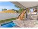 Outdoor space with a grill, wood stairs and small pool at 2200 Bay Blvd # B, Indian Rocks Beach, FL 33785