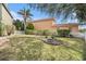Scenic backyard featuring a classic water fountain and lush landscaping at 5802 Hatteras Palm Way, Tampa, FL 33615