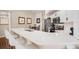 Kitchen with a large white quartz countertop and island seating at 5802 Hatteras Palm Way, Tampa, FL 33615