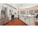 A bright kitchen featuring stainless steel appliances, and light-colored cabinets at 5802 Hatteras Palm Way, Tampa, FL 33615