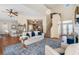 Spacious living room with staircase, hardwood floors, and fireplace at 5802 Hatteras Palm Way, Tampa, FL 33615