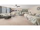 Spacious living room with ample seating, neutral decor, and bright natural light at 5802 Hatteras Palm Way, Tampa, FL 33615