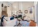 This living room offers high ceilings, a cozy fireplace, and elegant furnishings at 5802 Hatteras Palm Way, Tampa, FL 33615