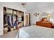 Bedroom with open closet and dresser at 12205 Kelly Ln, Thonotosassa, FL 33592