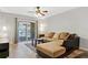 Living room with sliding doors to the outside and tile flooring at 15215 Amberly Dr # 1004, Tampa, FL 33647