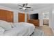 Comfortable bedroom featuring a ceiling fan, dresser, and view of the bathroom at 1767 Colorado Ne Ave, St Petersburg, FL 33703