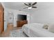 Bedroom featuring ceiling fan, large dresser, and access to bathroom and closet at 1767 Colorado Ne Ave, St Petersburg, FL 33703