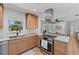 Updated kitchen with stainless steel appliances, butcher block counters, and wood cabinets at 1767 Colorado Ne Ave, St Petersburg, FL 33703
