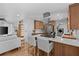 Modern open-concept kitchen with stainless steel appliances and breakfast bar at 1767 Colorado Ne Ave, St Petersburg, FL 33703