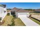 An aerial view of home with a manicured lawn and driveway at 3603 Lajuana Blvd, Wesley Chapel, FL 33543