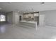 Modern kitchen with marble counter tops, kitchen island, stainless steel appliances, and white cabinets at 383 Yeager St, Port Charlotte, FL 33954