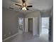 Comfortable bedroom with a fan, ensuite bathroom and closet space at 383 Yeager St, Port Charlotte, FL 33954