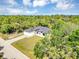 New home with mature landscaping and a private setting at 82 Venango St, Port Charlotte, FL 33954