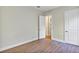 Bedroom featuring wood-look floors, neutral walls, and access to closet at 82 Venango St, Port Charlotte, FL 33954