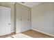 Bright bedroom with wood-look floors and a large closet space at 82 Venango St, Port Charlotte, FL 33954