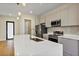 Modern kitchen features stainless steel appliances, stone countertops and wood flooring at 82 Venango St, Port Charlotte, FL 33954