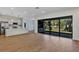 Open floor plan of the living room and kitchen with breakfast bar and stainless steel appliances at 82 Venango St, Port Charlotte, FL 33954